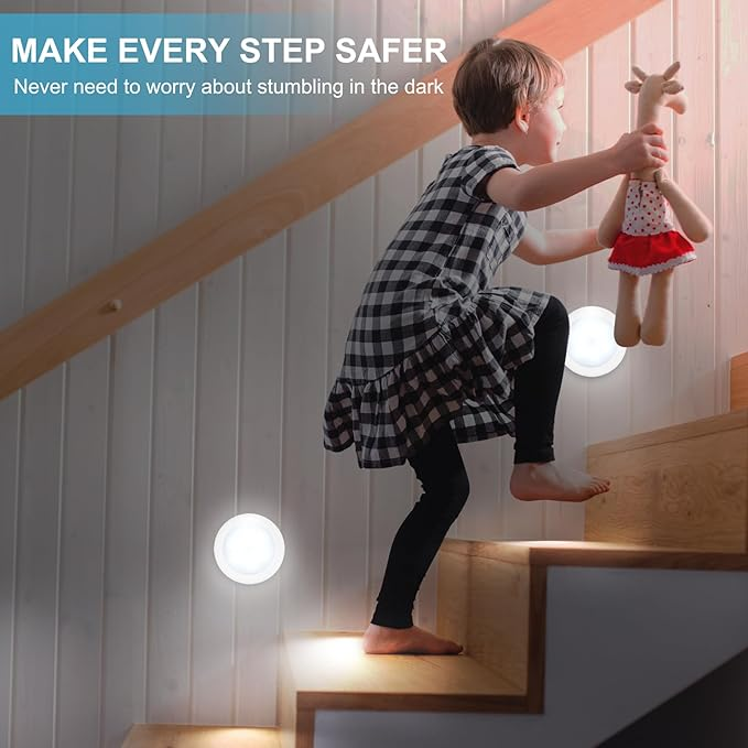 Child safely walking down stairs with LED motion sensor night lights
